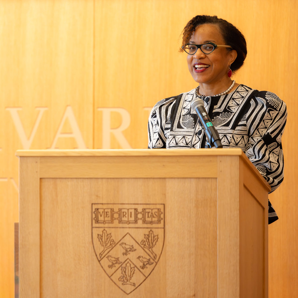 Dean Frederick speaking at podium during a discussion held at HDS