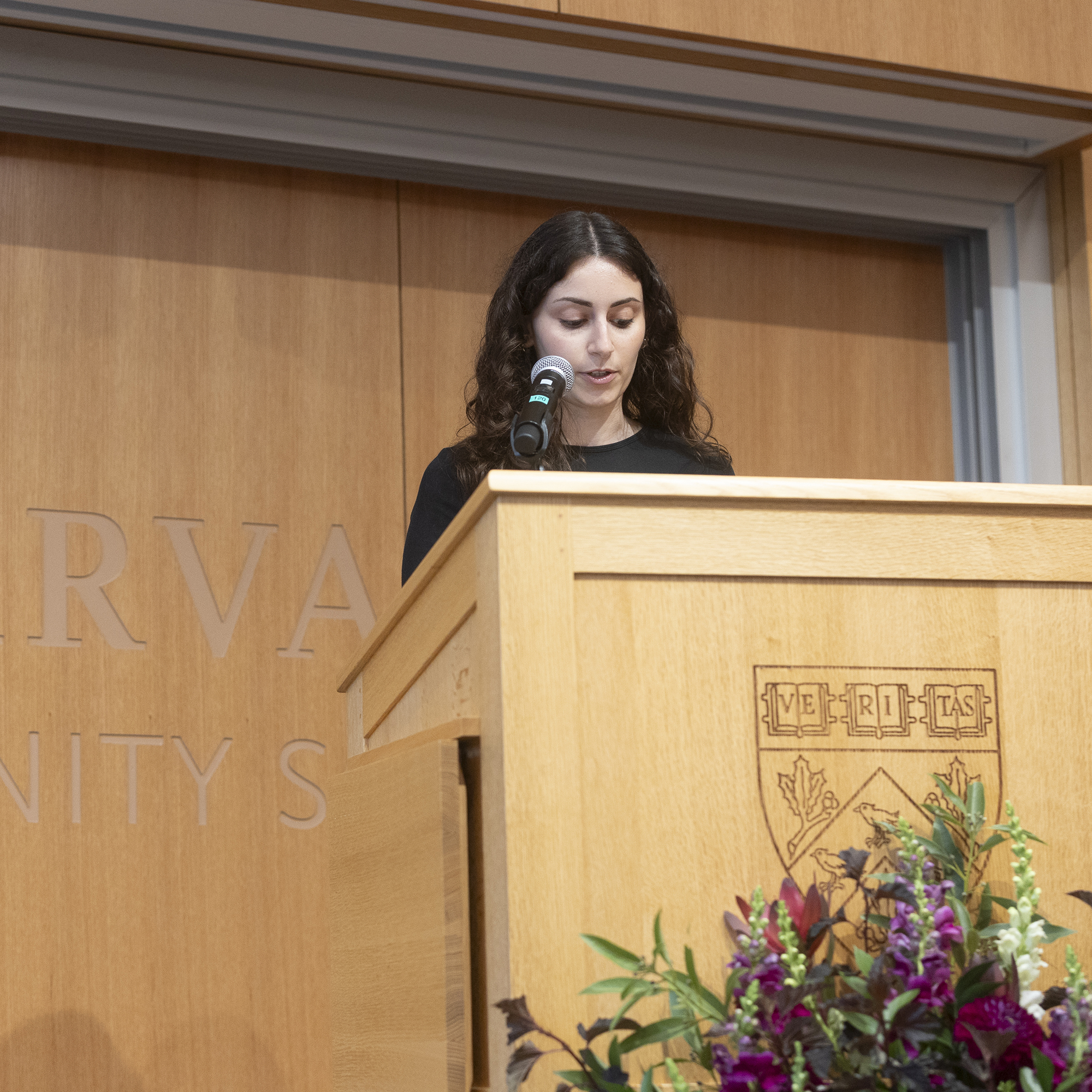 Emma Scharff reads a poem during Convocation