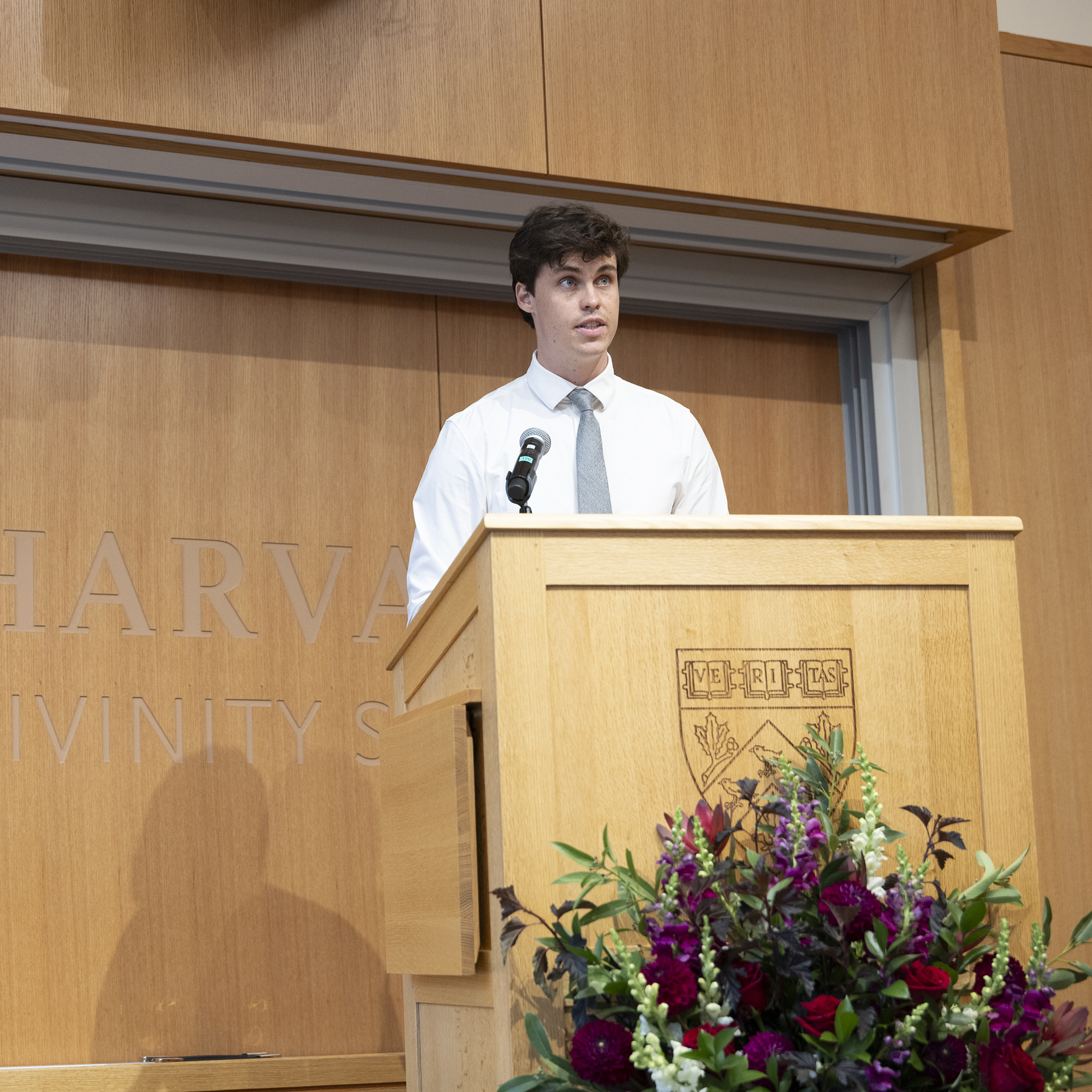 Clay Wackerman recites a poem during Convocation