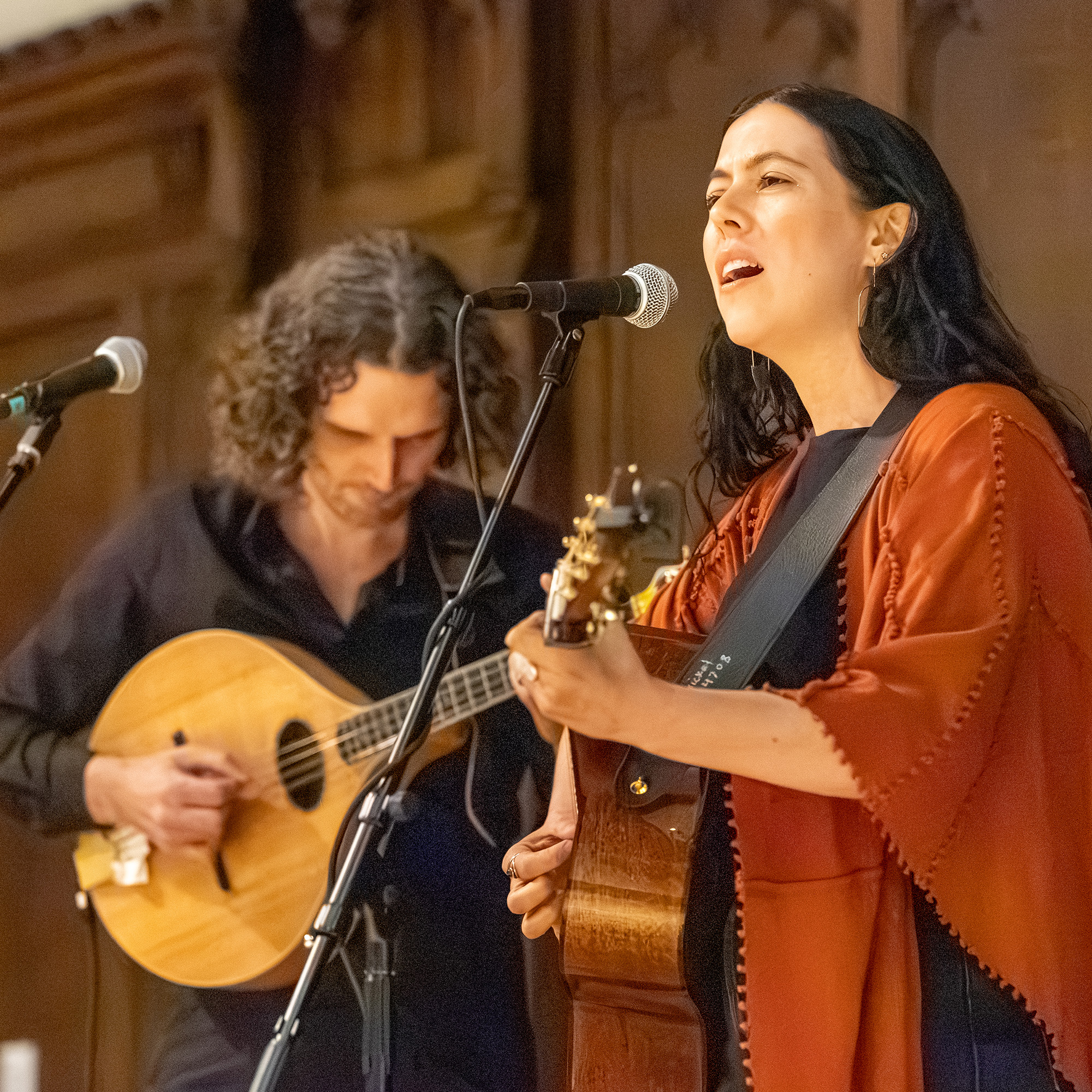 Duncan Wickel and Lily Henley perform on stage