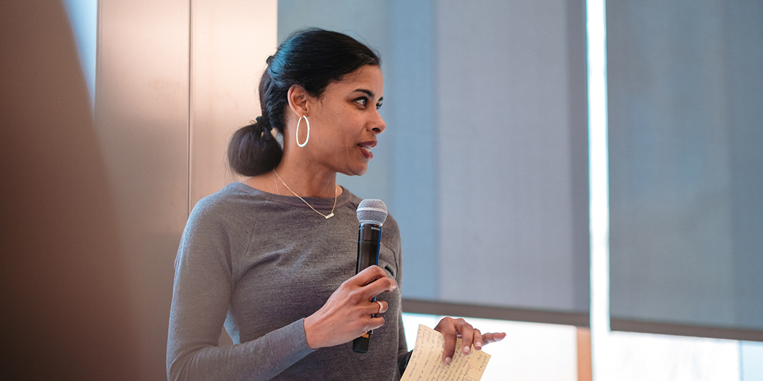 Sara Bleich speaks into a microphone