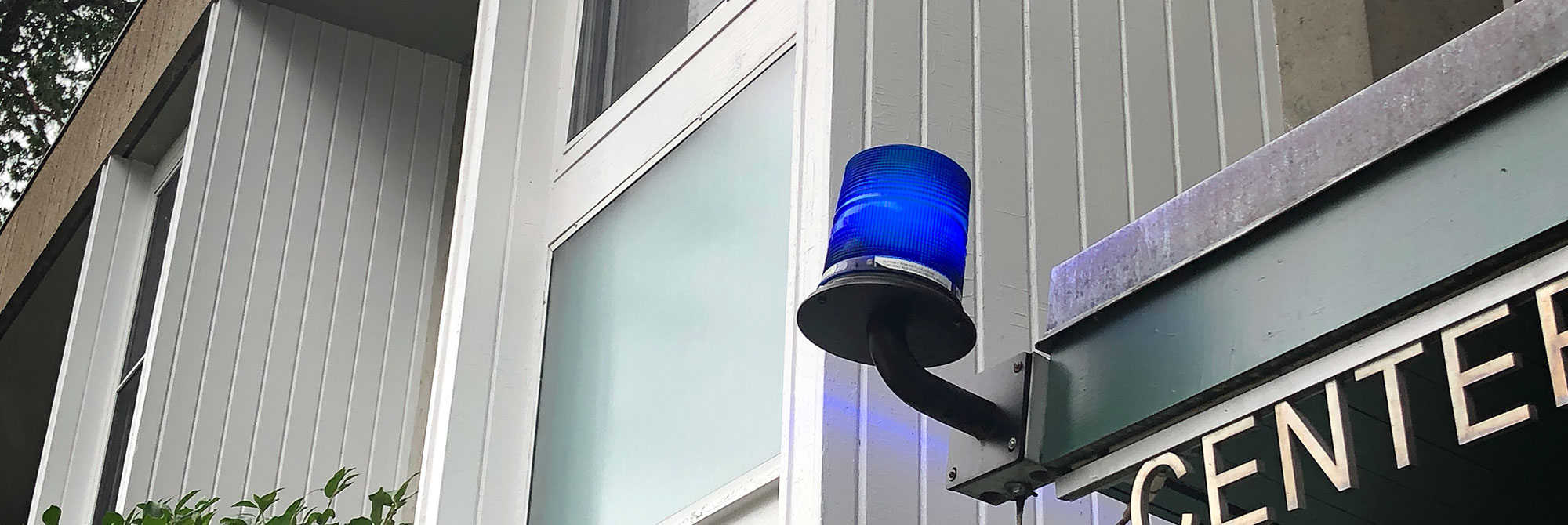 Campus safety Blue Light marking an emergency phone outside the CSWR