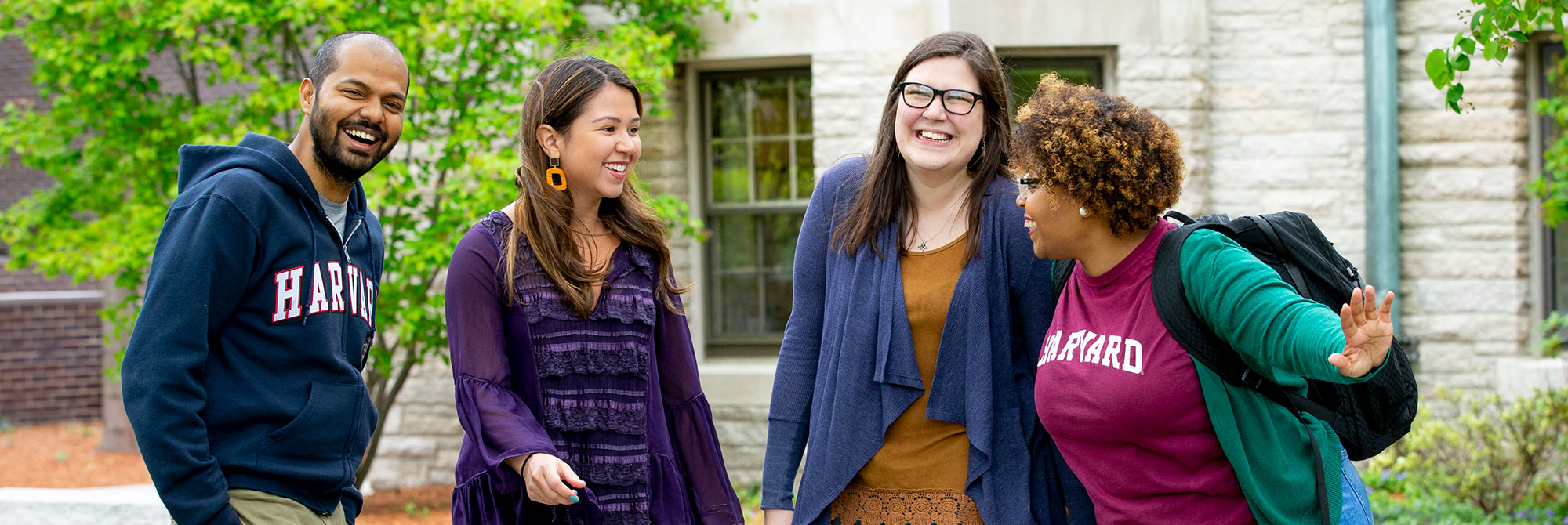 Four HDS students laughing together outside