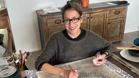 Katarina Wong working at a desk