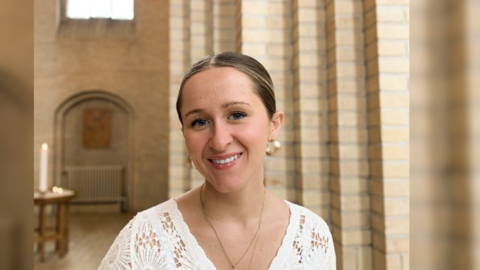 A headshot of Kat Woodard