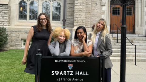 All four HDS Admissions Graduate Assistants, on the grass behind the sign for Swartz Hall on the HDS campus.