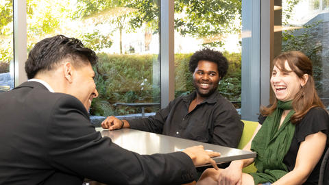 Four students hanging out in the HDS cafe