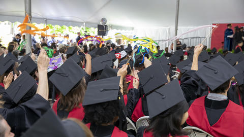 HDS graduates wave ribbons during Commencement 2026