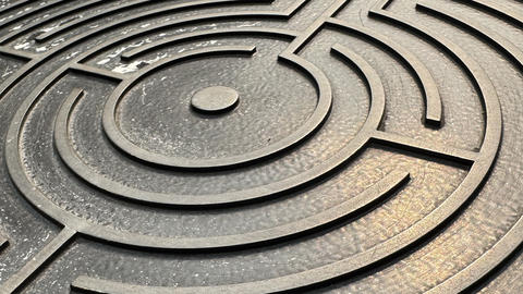 Detail of metal labyrinth on sign