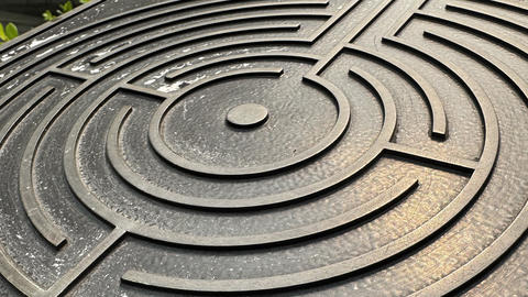 Detail of metal labyrinth on sign