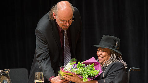 HDS Professor Davíd Carrasco hands Toni Morrison flowers during the 2012 Ingersoll Lecture at Harvard. Photo: Justin Knight