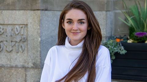 Maggie Helmick in front of Swartz Hall
