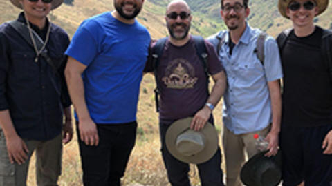 Professor Giovanni Bazzana poses with students during a trip to Israel