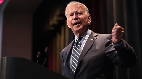 Picture of Joe Biden, giving a speach.