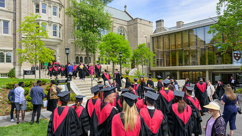 New HDS graduates line up outside of Swartz Hall.