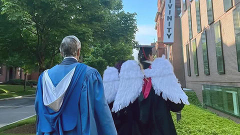 Dean Hempton and students walking to the HDS campus
