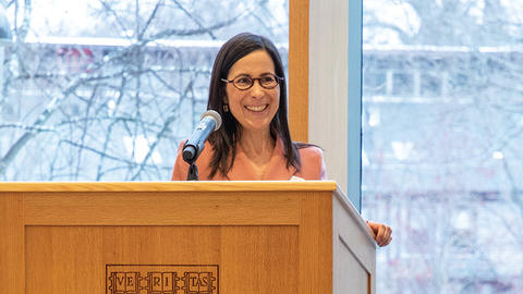 Professor Rivera standing at a podium