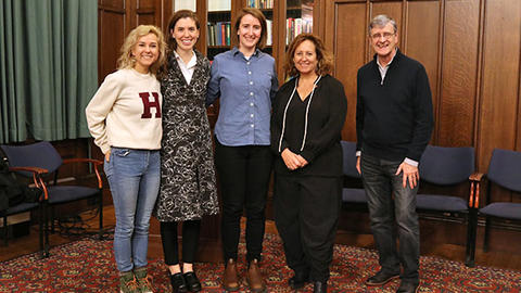 Three student organizers of the Film Festival pose with director Kim A. Snyder and Dean Hempton.