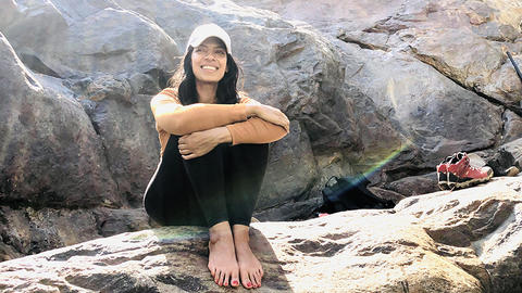 Sonya Soni sitting on a rock