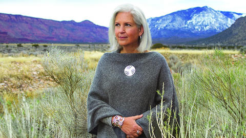 Terry Tempest Williams outdoors with mountains in the background