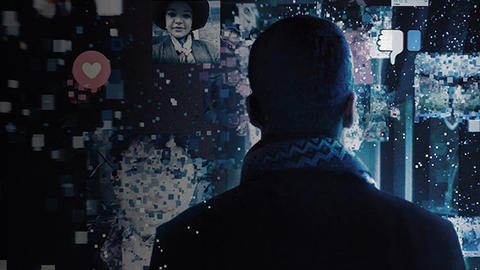 A figure with its back to the camera looks at a transparent screen with various social media posts