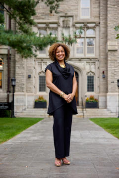 Dean Marla Frederick standing before entry to Swartz Hall
