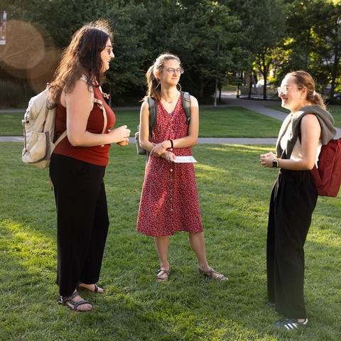 HDS community members talk outside on the lawn