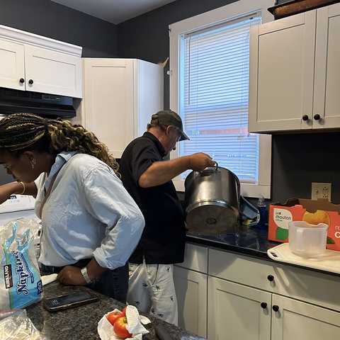 Sarah Adegbite serving alongside community member
