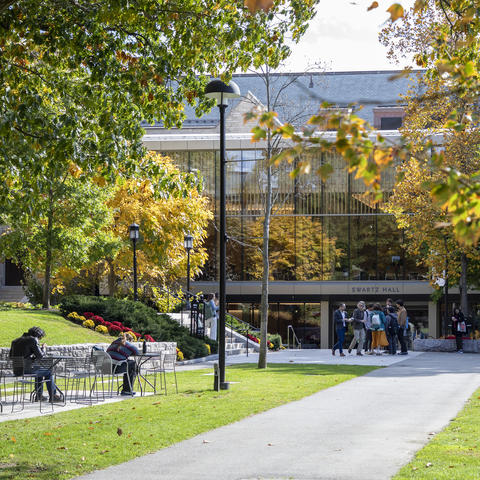 Outside at HDS in the fall with people on the green