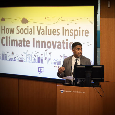 Professor Johnson at a podium speaking