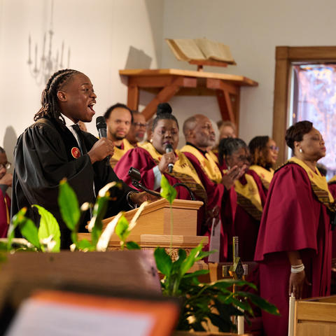 Person singing at pulpit