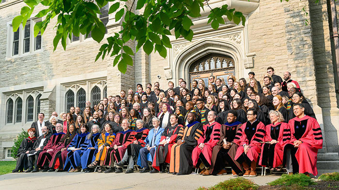 Students and faculty gather on the steps of Swartz Hall for the annual class photo