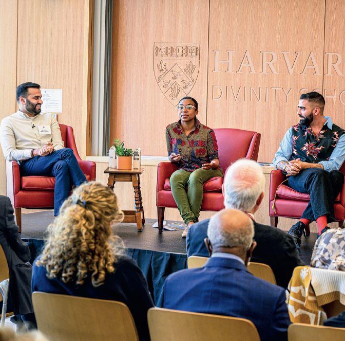 Audience members facing students seated and taking part in a panel discussion in the James Room of Swartz Hall