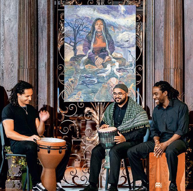 Three people in a drum circle
