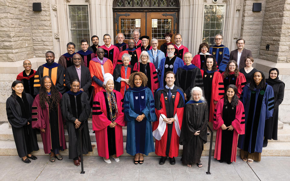 HDS faculty pose for photo in gowns at convocation