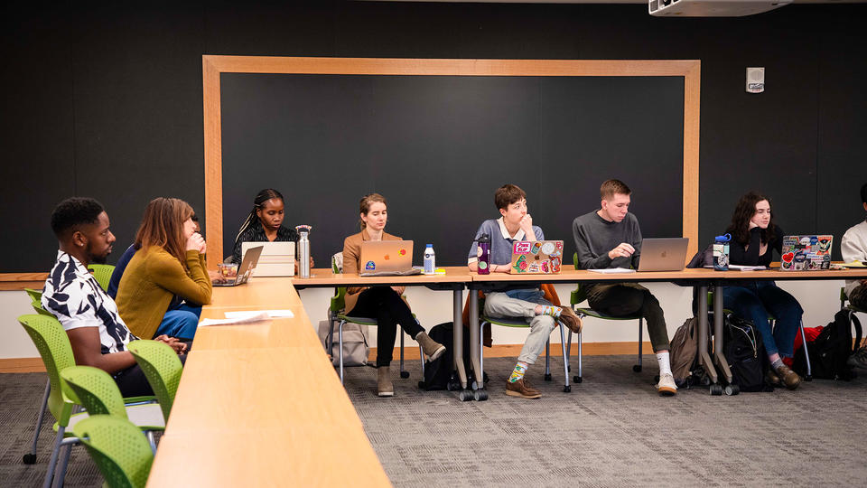 HDS students seated at classroom tables, showing dynamic classroom environment