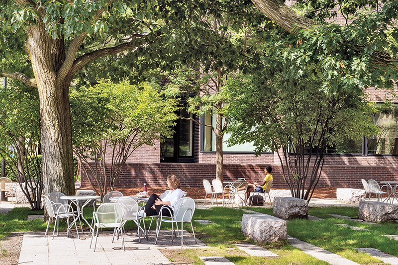 Green Space on HDS campus with people sitting in chairs