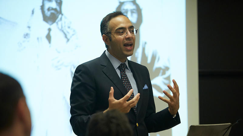 Tarek Masoud presents at the front of a classroom