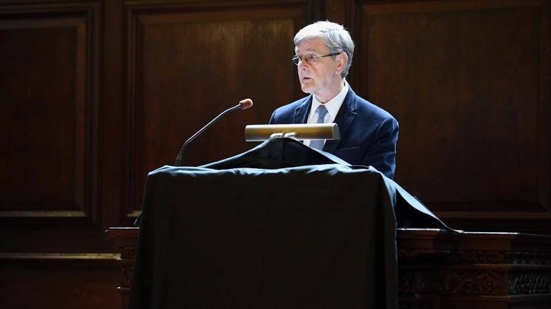 Dean David Hempton at a podium