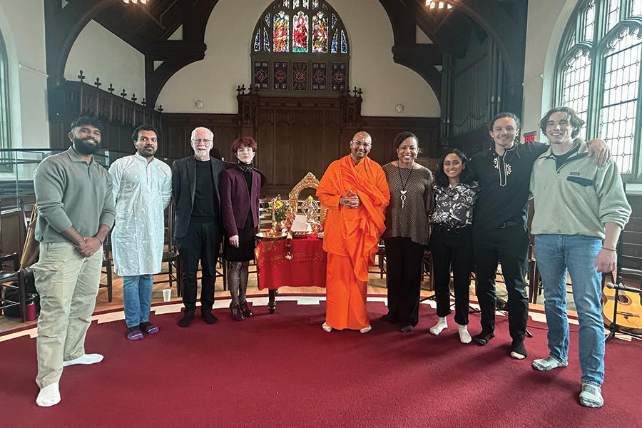 Students and school leaders posing in the chapel