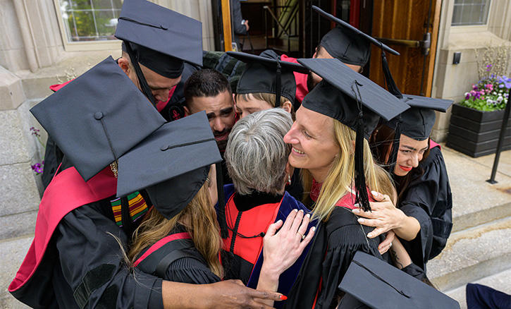 MRPL degree grads group hug