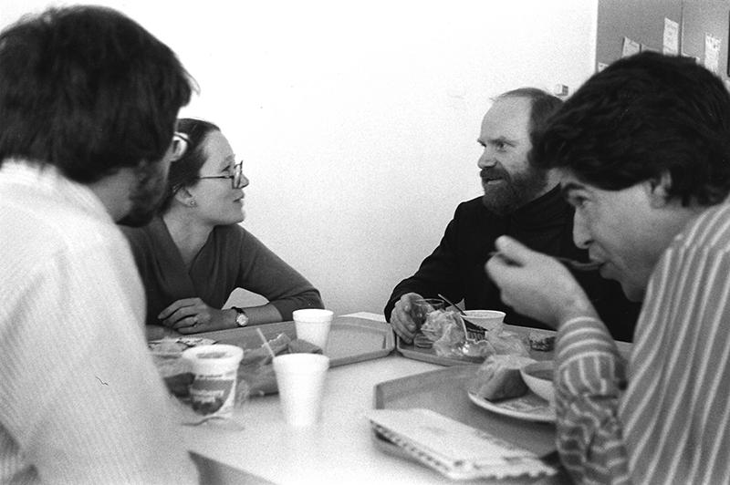 Paul Hanson dining with student at a table