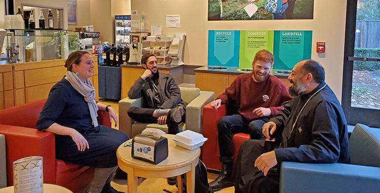Fr. Pishoy Salama with students in Rock Cafe.