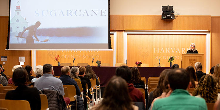 Terry Tempest Williams speaking at the front of the James Room