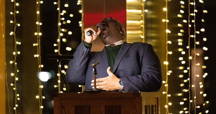 Teddy Hickman-Maynard singing during the Seasons of Light service