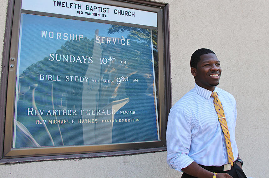 Willie Bodrick standing in front of the 12th Baptist Church
