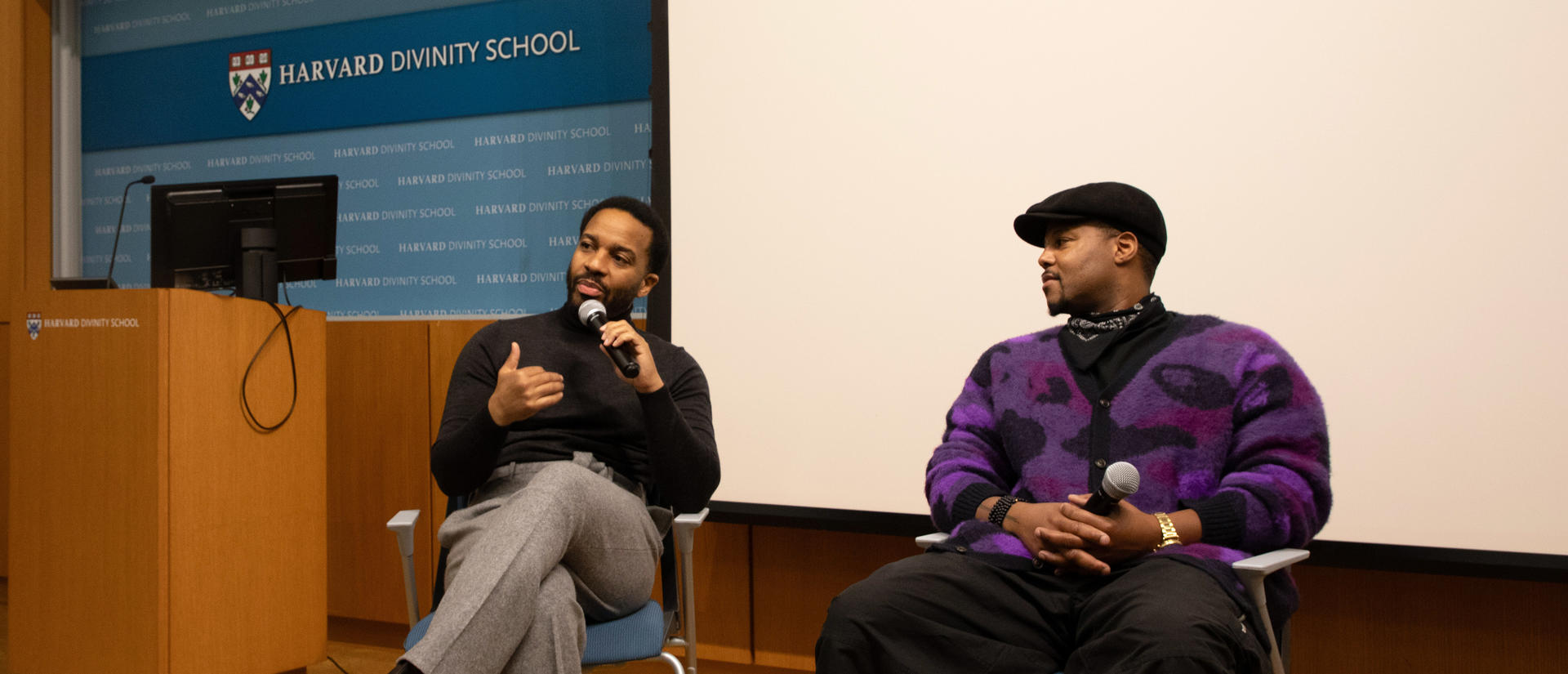 Andre Holland and Titus Kaphar speaking at a panel before audience