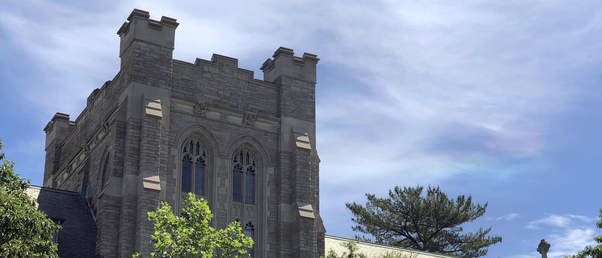 Andover Hall against blue sky with white clouds
