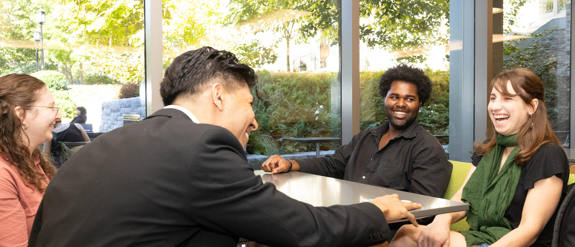 Four students hanging out in the HDS cafe