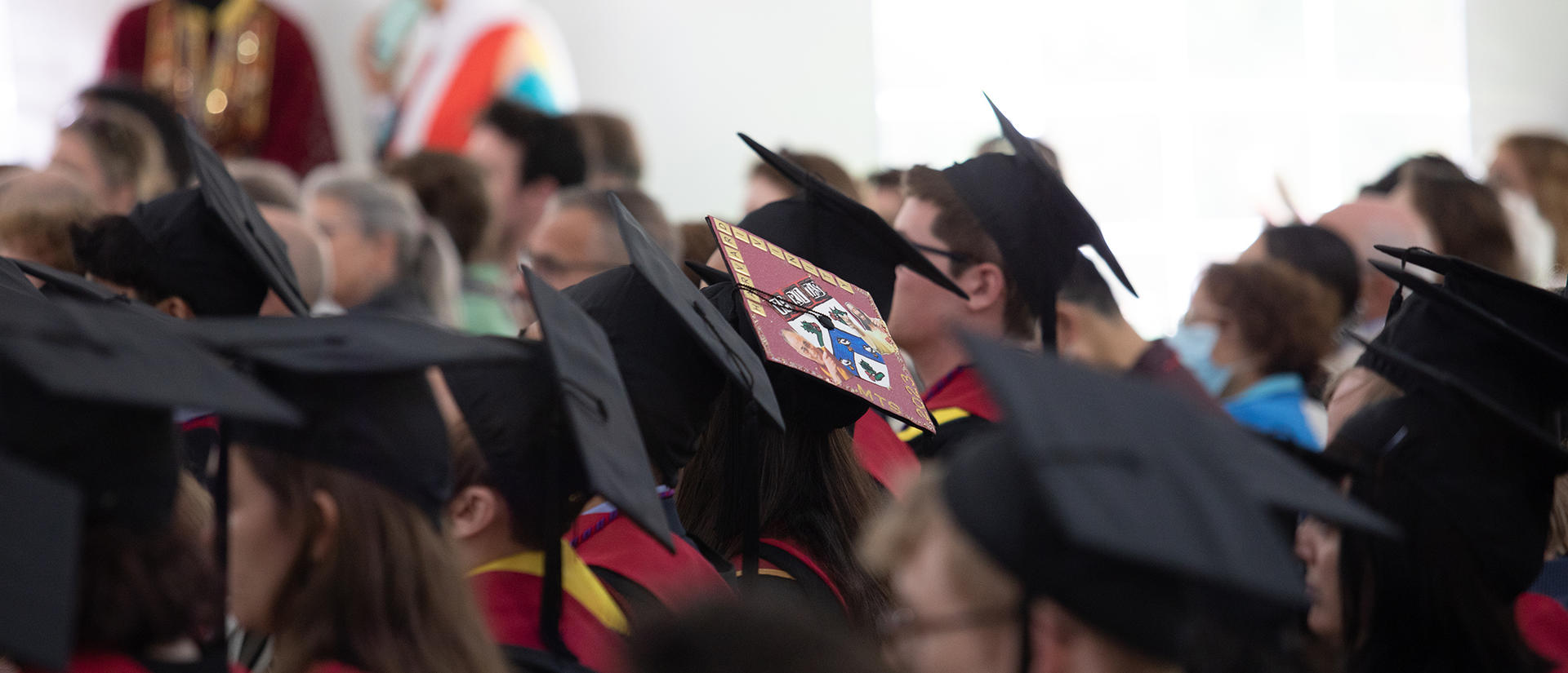 HDS graduates sit in cap and gowns during Commencement
